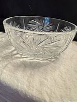 Side view of clear cut crystal bowl showing starburst and fan cuts