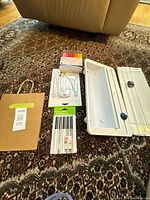 Lot overview showing trimmer board, tool set, two pen packs