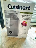 Front of sealed retail box showing Cuisinart Pure Indulgence ice cream maker