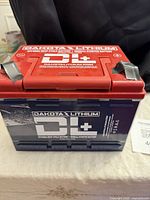 Front view showing Dakota Lithium branding and specification print