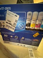 Back of Epson ET-2800 printer retail box showing Epson 522 ink bottles