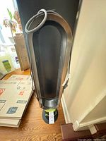 Top view of bladeless tower fan showing air loop and cord
