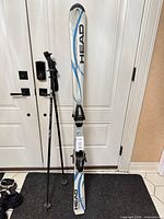 Full view of Head skis with poles
