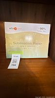 Front view of HTVRONT sublimation paper box showing product details