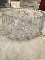 Full view of bowl with scalloped rim and cut pattern