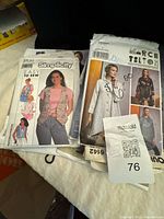 Top view showing Simplicity 9830 and Vogue Marci Tilton pattern envelopes