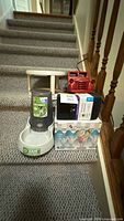 All five items grouped on staircase