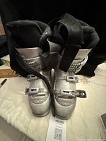 Front view of both Nordica ski boots showing buckles, branding and power strap