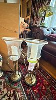 Pair of hurricane candle holders with shades and candles