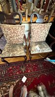 Pair of solid wood dining chairs side by side