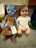 Both dolls side by side showing size and outfits