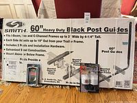 Box containing 60" Smith trailer post guides with LED lights package and U-bolt kit placed in front