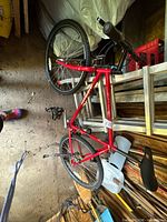 Full view of red Specialized mountain bike in storage area