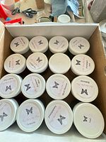 Top view of box showing labeled jar lids