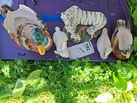 All five animal pieces on purple lid
