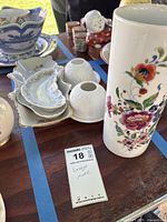 Group shot of Limoges porcelain showing vase, bowls, dishes, holders