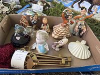 Overview of entire lot inside box showing all figurines and brass items