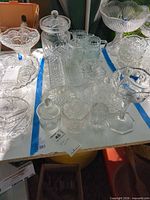 Overview of all clear glass pieces on table