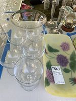 Group view of six stemmed goblets, large clear bowl, hand-painted tray