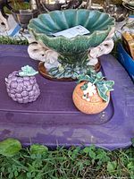 Set of three ceramic pieces displayed together