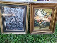 Both framed prints side by side on grass