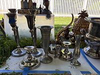 All silver-plated pieces grouped on table