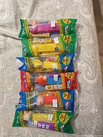 All six sealed PEZ dispensers laid out