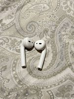 Top view of both Apple AirPods earbuds
