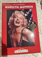 Front of boxed set showing Marilyn Monroe cover image and label indicating 8 varnished prints