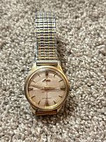 Front view showing dial, case, bracelet