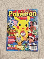 Front cover showing Pikachu, Ash, multiple Pokémon, magazine details