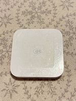 Top view showing NFC logo and worn surface