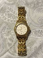 Front view showing entire watch, bracelet, dial, bezel