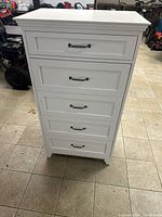 front view of white five-drawer tallboy chest