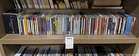 Entire middle shelf row of CDs