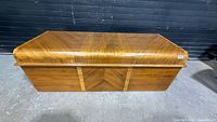 Full view of Lane cedar chest showing exterior wood veneer and lock