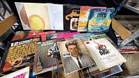 Overall view of records on shelf showing titles and cover conditions