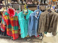 Group shot of all four jackets hanging on rack