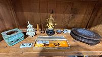 entire lot on shelf showing brazier, stacking container, small vases, figure, presentation box, large stands