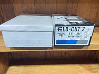 Two Palladium Lo-Cut 2 shoe boxes showing model, size and colour info