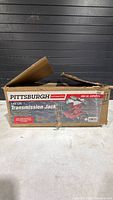 Sealed retail box showing Pittsburgh Automotive low lift transmission jack graphics