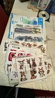Stack of all vinyl sticker sheets showing variety of designs