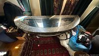 Top view showing demi-lune shape, glass inset, faux marble laminate