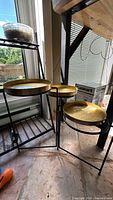 All three metal tray tables grouped to show size variation and structure