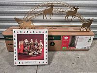 Boxed Holiday Time tree, nativity set box, metal topper displayed