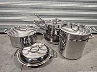 Group shot of all cookware pieces showing quantity and general condition