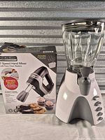 Blender assembled beside Hamilton Beach hand mixer retail box