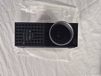 Front lens and ventilation grille of Dell M109S projector