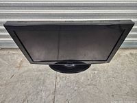 Front angled view of Dynex 32-inch LCD TV on stand