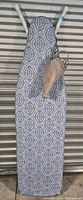 Ironing board with cover and iron hanging
